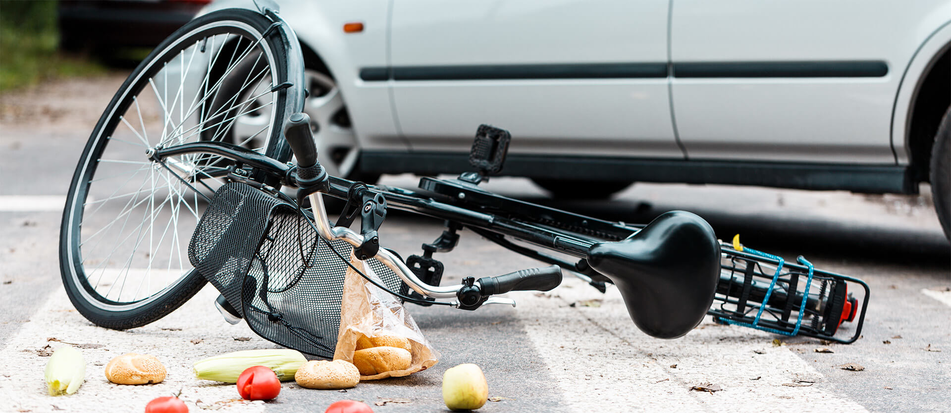 a damaged bike on the road from an accident