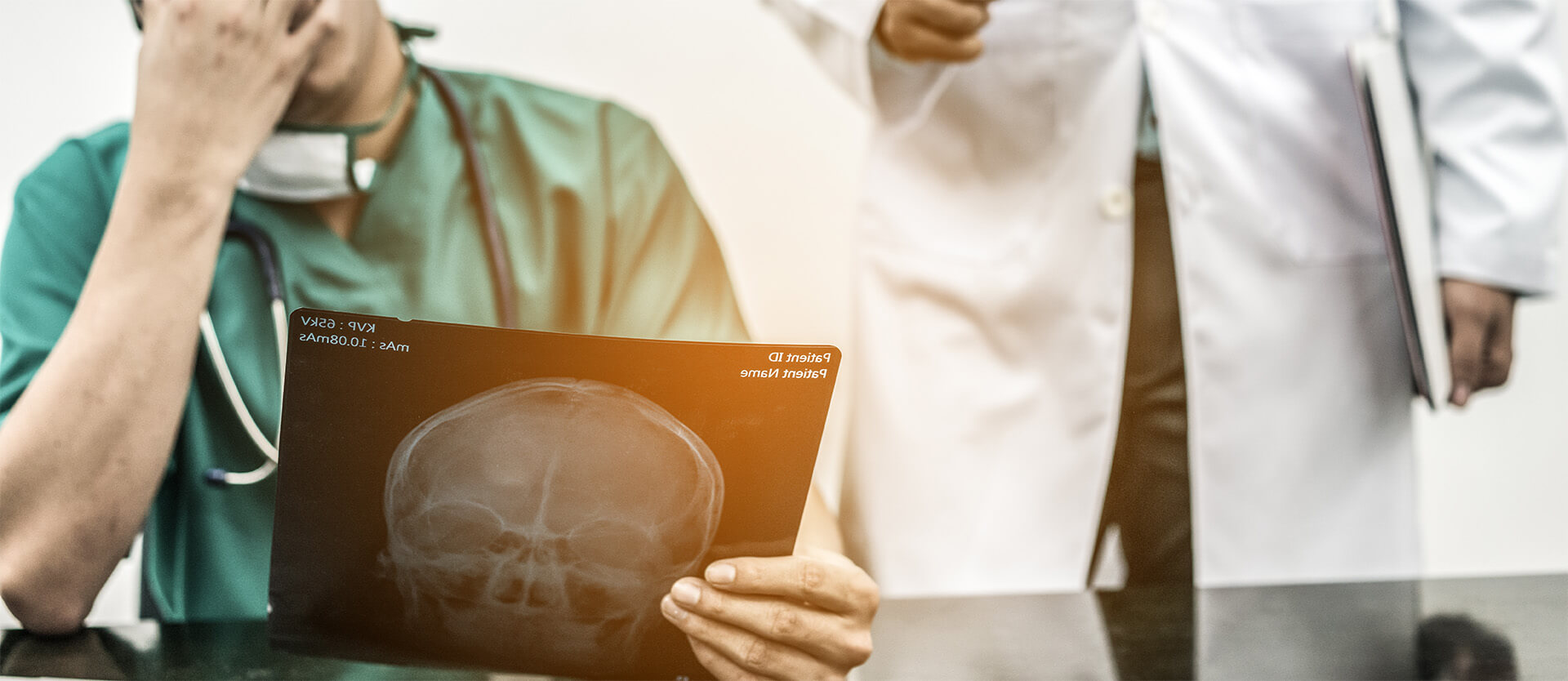 two doctors looking at an X-ray