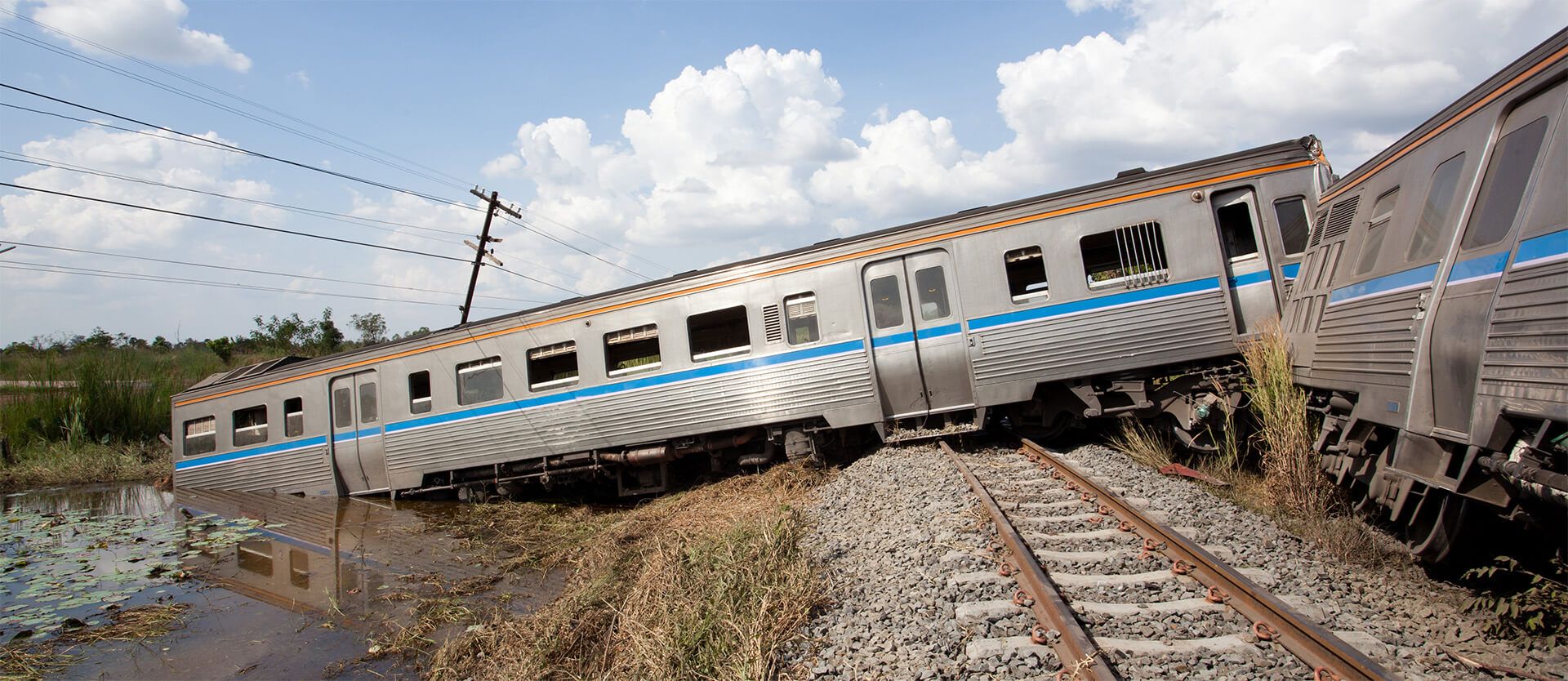 a train accident with damaged train cars