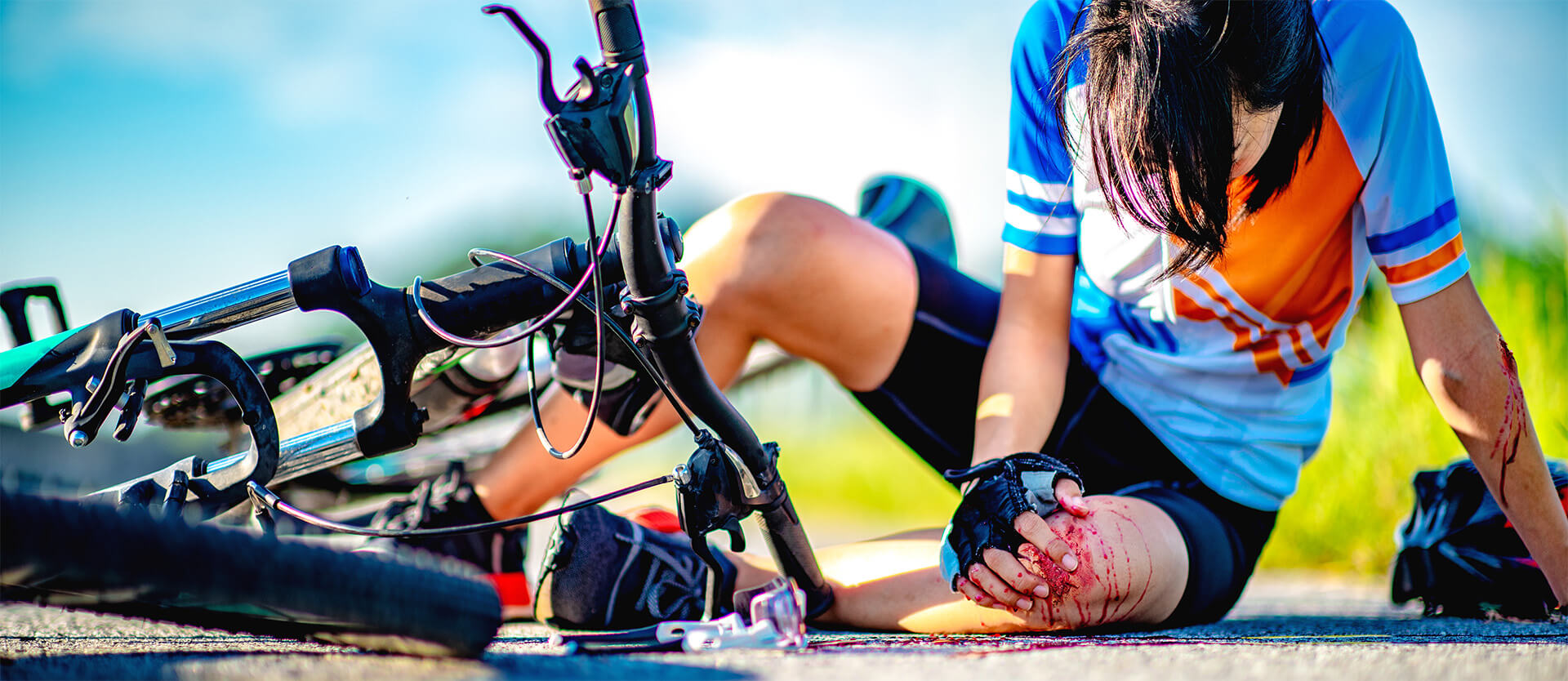 an injured bike rider on the road