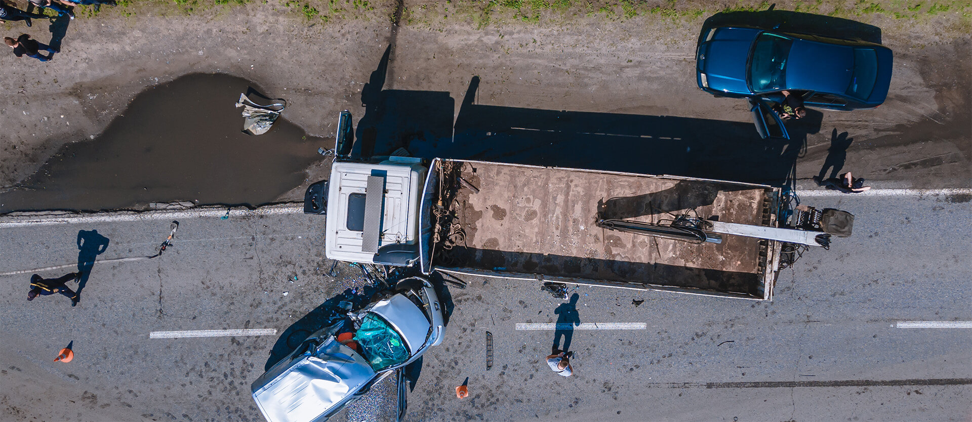 aerial view of a car crashing into a truck