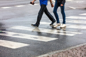 two men walking on pedestrian crossing