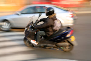 a motorcycle about to hit a car