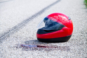 an accident with a motorcycle. traffic accident and skid marks on road. symbol photo.