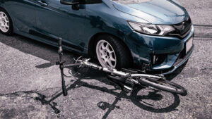 a car crashing into a bicycle