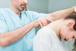 a doctor inspecting a patient's neck