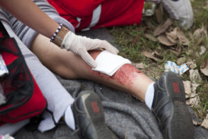 a person receiving a bandage from their personal injury
