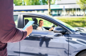 a person using a Las Vegas rideshare app to hire an Uber or Lyft rideshare driver